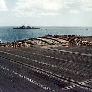 Damaged_flight_deck_of_USS_Enterprise_CV-6_in_August_1942-640x480.jpg